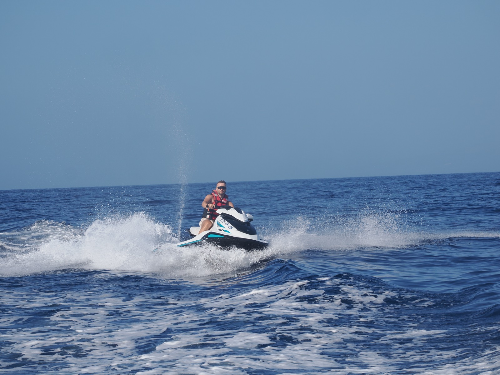 Jet ski turning hard on a short circuit ride